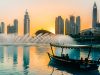 Emirates y Accor refuerzan sus programas de fidelización con más ventajas para sus clientes a boat on the water with a fountain in the background